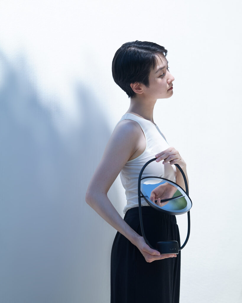 Model with Lei light reflection in a softly lit setting
